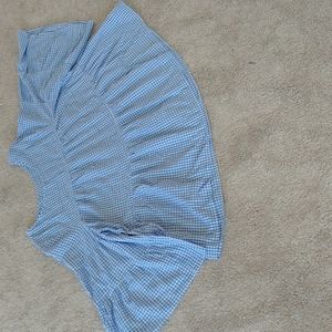 A blue and white gingham peasant blouse